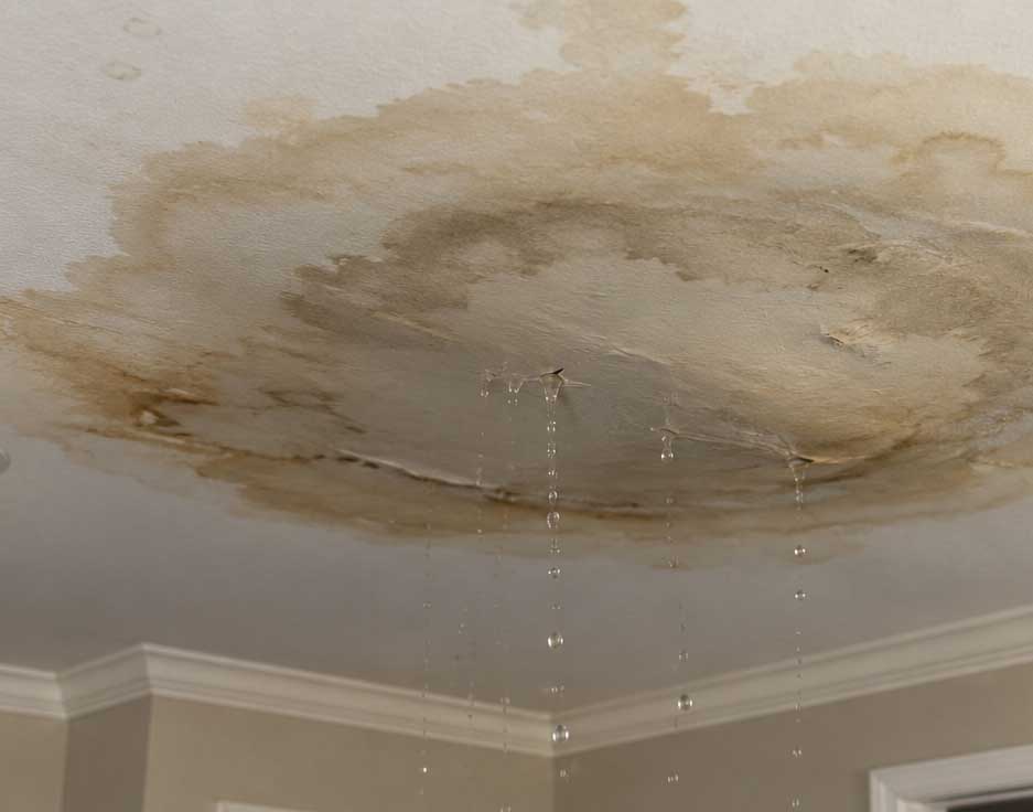 Ceiling Water Damage from HVAC Overflow | Austex Air Ceiling water damage caused by an overflowing attic HVAC unit leaking through drywall.